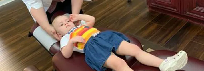 Chiropractor Webster TX Allison Long Adjusting Child